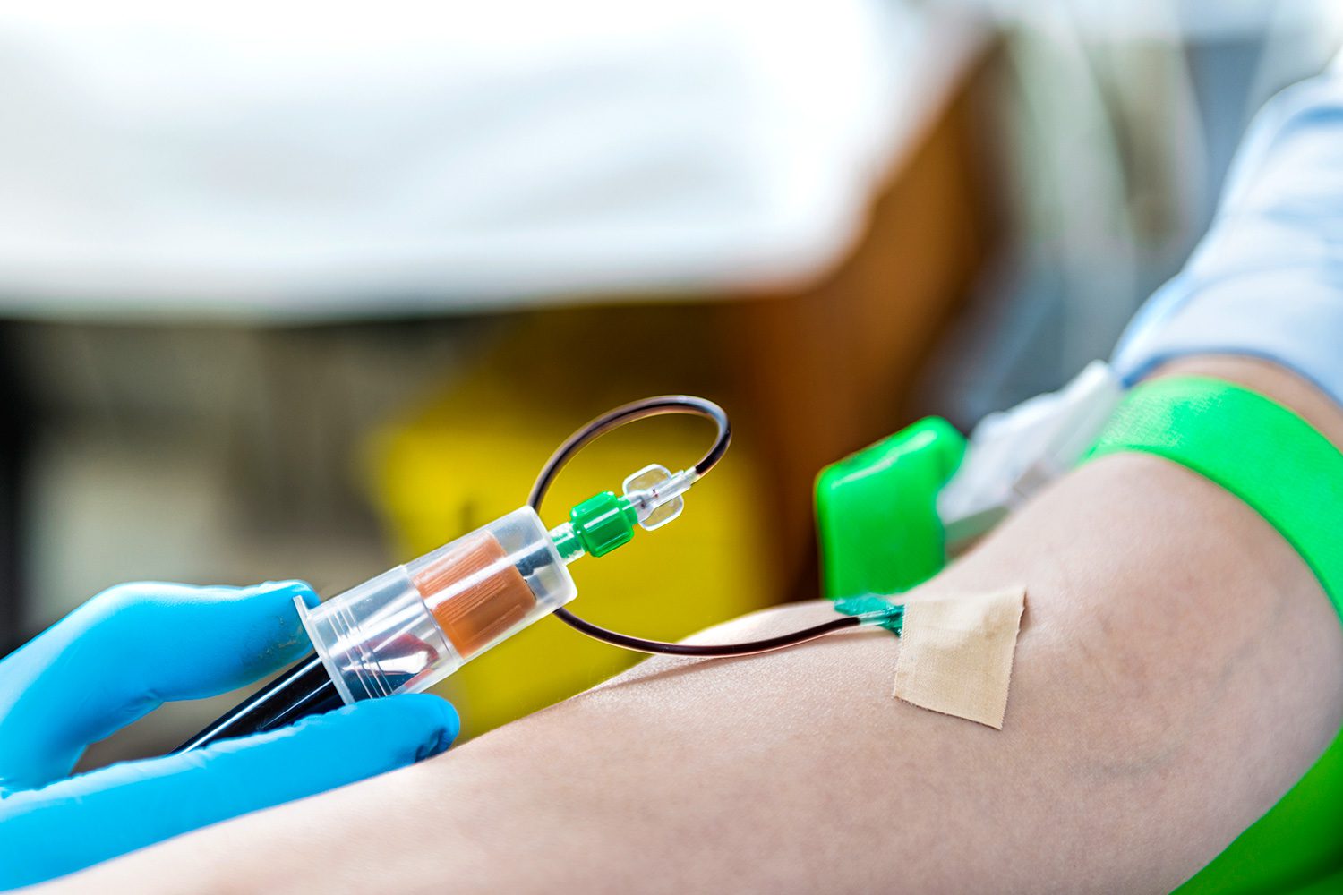 A person is getting their blood drawn with an iv.