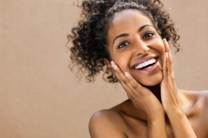 woman smiling after fantastic face treatment