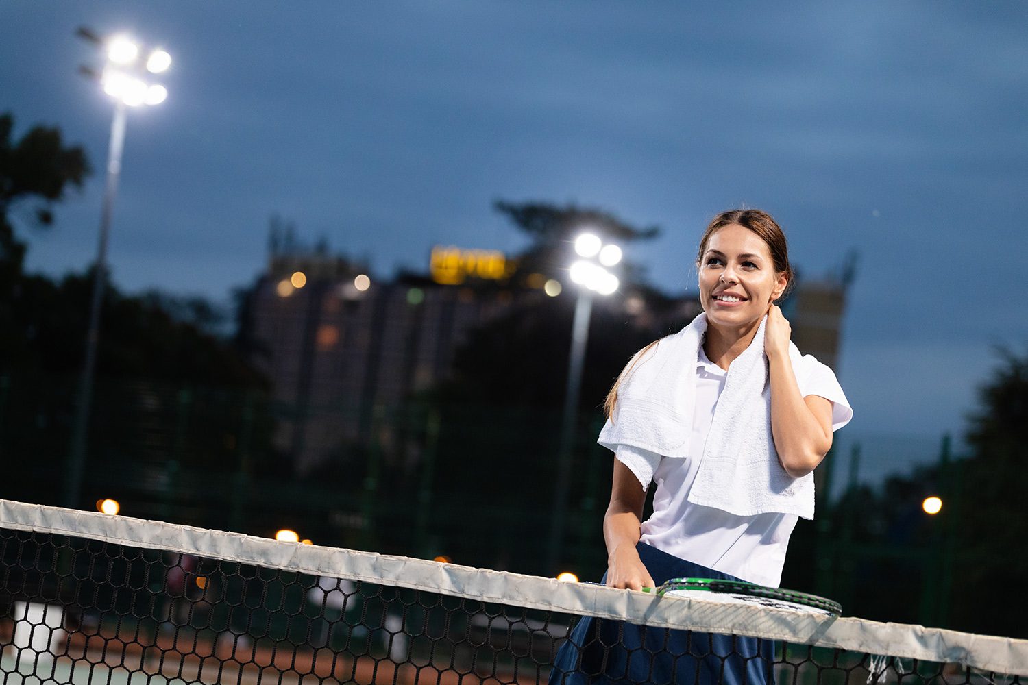 A woman standing on top of a tennis court.