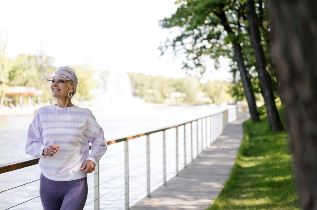 Am I a Good Candidate for an Epidural Steroid Injection? Regenerative Medicine & Orthopedics Miami Senior woman jogging by the lake.